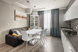 Kitchen and sofa on one wall in the interior