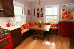 Kitchen and sofa on one wall in the interior