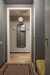 Door With A Mirror In The Interior Of A Small Entrance Hallway