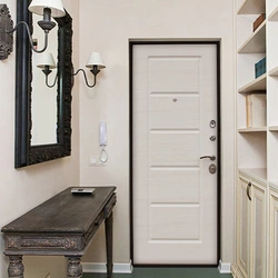 Door with a mirror in the interior of a small entrance hallway