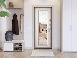 Door with a mirror in the interior of a small entrance hallway