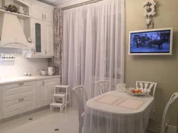 Light kitchen design with TV