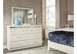 Bedroom design with chest of drawers and table