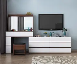 Bedroom design with chest of drawers and table