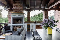 Terrace design with fireplace and kitchen