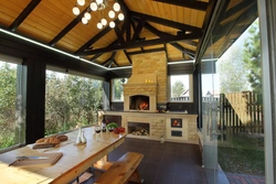 Terrace design with fireplace and kitchen