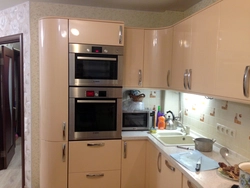 Corner kitchen design with refrigerator and microwave