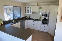 Living room kitchen design with a window in the working room