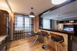 Design of a studio apartment with a kitchen by the window