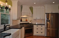 Kitchen Design With A Refrigerator In The Corner By The Window