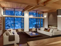 Living room design in a country house with large windows