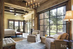 Living room design in a country house with large windows