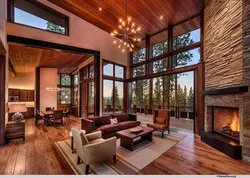 Living room design in a country house with large windows