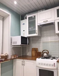 Kitchen Design With A Refrigerator By The Window And A Gas Stove