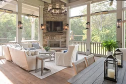 Design of a kitchen living room with a fireplace and access to the terrace