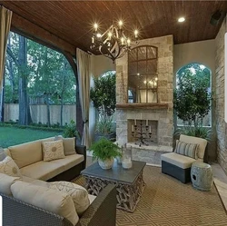 Design Of A Kitchen Living Room With A Fireplace And Access To The Terrace