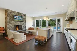 Design of a kitchen living room with a fireplace and access to the terrace