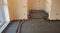 Pipes to the floor in the apartment photo