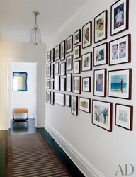Is it possible to hang photographs on the walls in the apartment?