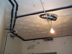 Wiring suspended ceiling along the ceiling in an apartment photo