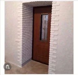 Stone decoration of the entrance door in the apartment photo