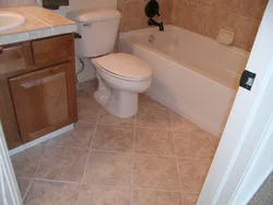 Bathtub in the floor in the apartment photo