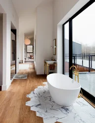 Bathtub in the floor in the apartment photo