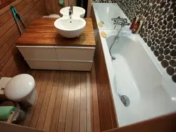 Bathtub in the floor in the apartment photo