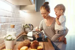 Photo of my mom at home in the kitchen