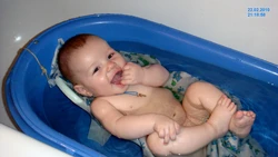 Photo of a newborn in the bath
