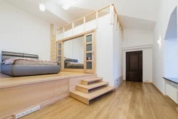 Bedroom with stairs photo