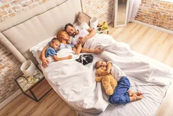 Photo Of Family In Bedroom