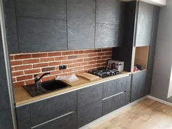 Photo of loft concrete kitchen