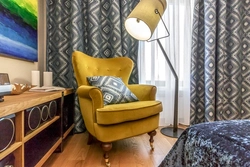 Yellow armchair in the bedroom interior