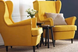 Yellow armchair in the bedroom interior