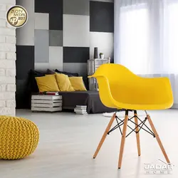 Yellow armchair in the bedroom interior