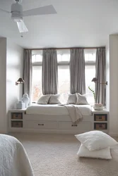 Bedroom design with a window in the center