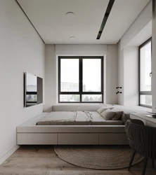 Bedroom design with a window in the center