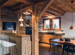 Living room kitchen design in chalet style