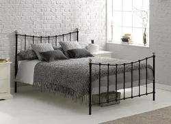 Bedroom design with white metal bed