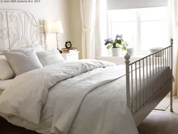 Bedroom design with white metal bed