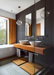 Bathroom design in dark colors with wood
