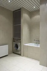 Bathtub design with a niche for a washing machine