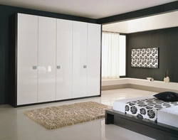 Bedroom wardrobe design in a modern style without mirrors