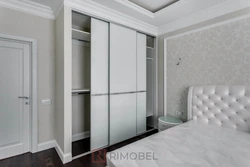 Bedroom wardrobe design in a modern style without mirrors