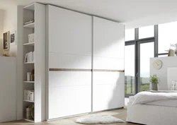 Bedroom wardrobe design in a modern style without mirrors