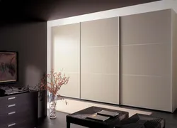 Bedroom wardrobe design in a modern style without mirrors