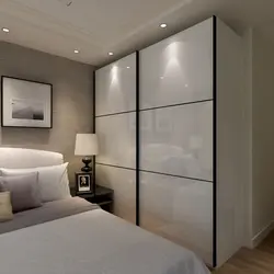 Bedroom wardrobe design in a modern style without mirrors