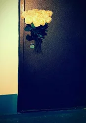 Flowers in the apartment door photo
