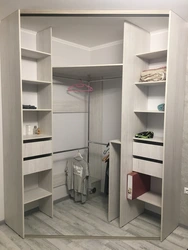 Corner wardrobe in a one-room apartment photo